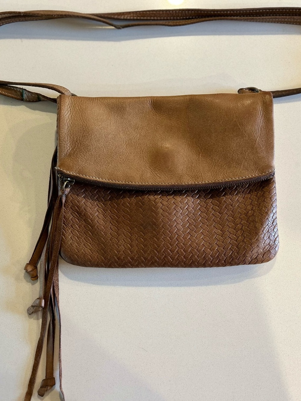 Roots Woven Leather Crossbody with Tassel